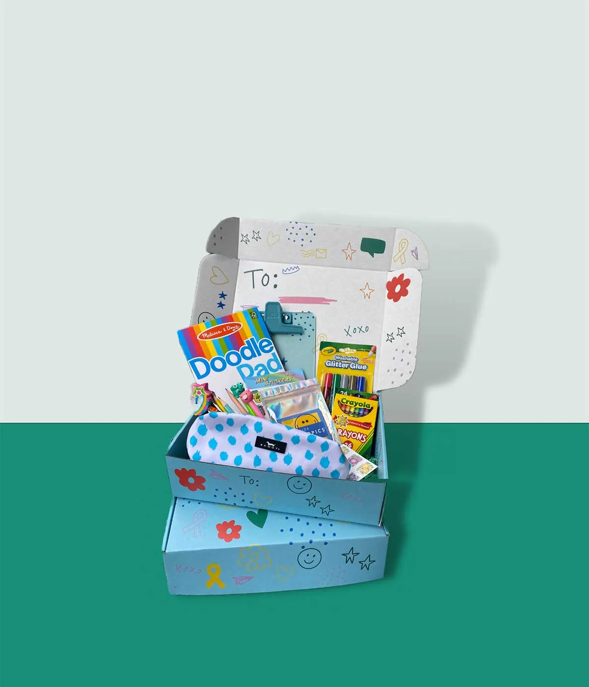 A Letters to Isabel Boombox filled with stationery and craft supplies